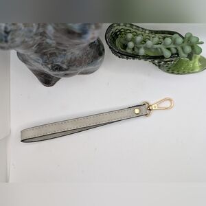 Gray leather wristlet strap with Gold hardware
